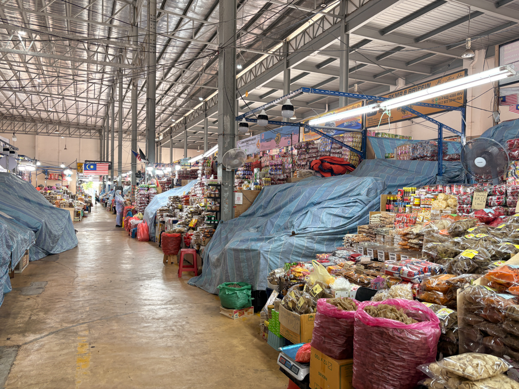 Pasar Sentral market in Kuala Terengganu, with aisles stacked high with dried fruits and snacks
